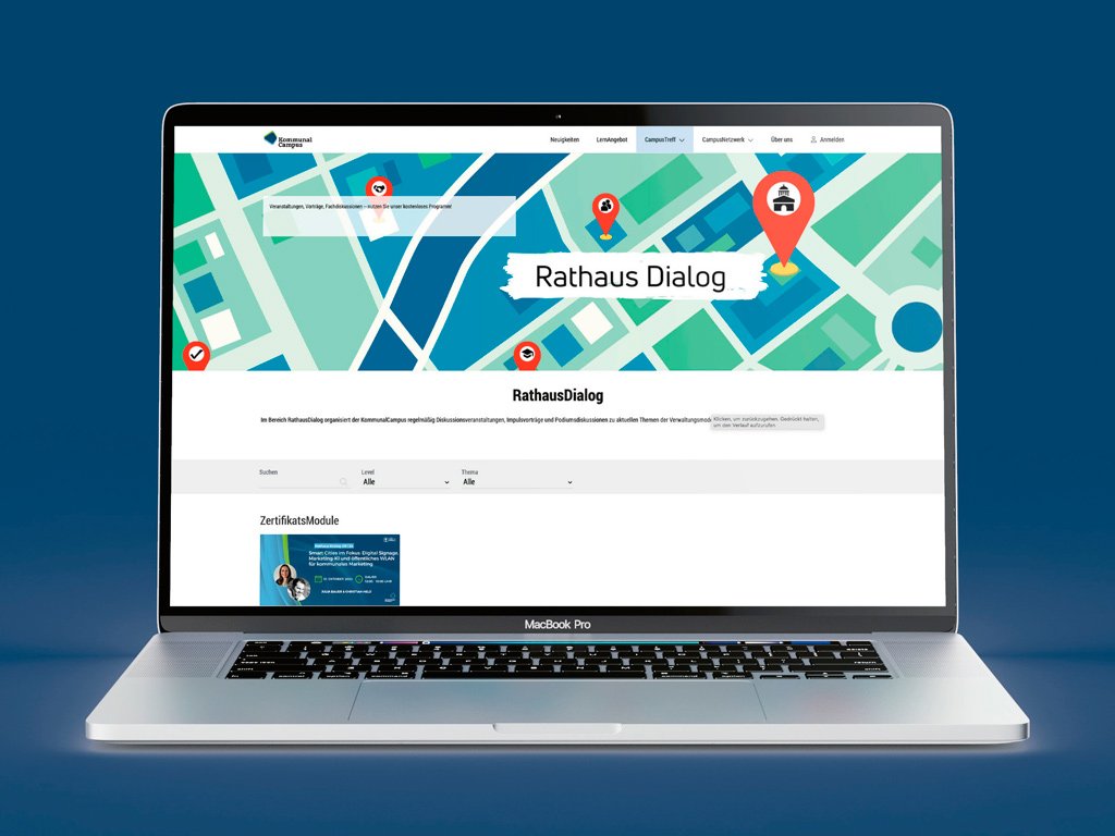 Ein Laptop-Bildschirm zeigt die Benutzeroberfläche der Plattform „Rathaus Dialog“ auf einer illustrierten Stadtkarte. Darüber ein Button mit der Aufschrift „Jetzt kostenlos reinschauen“.